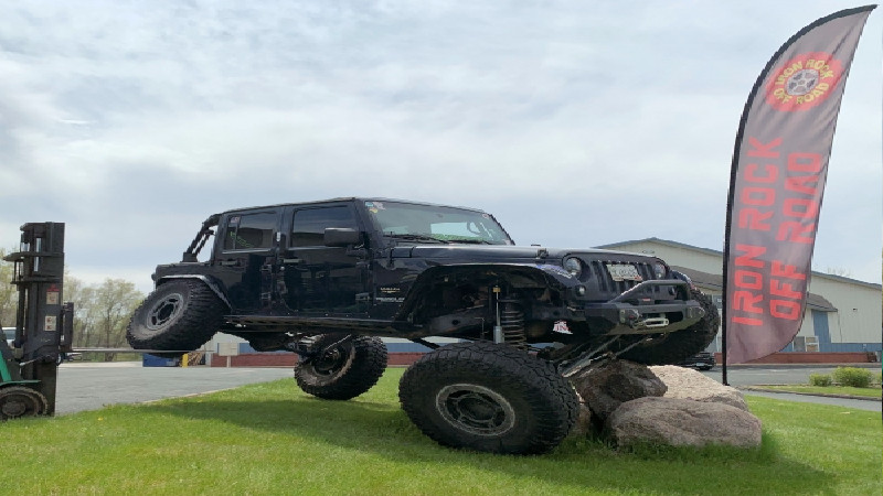 Lifting the Suspension System on a Used Jeep Wrangler SUV in MN